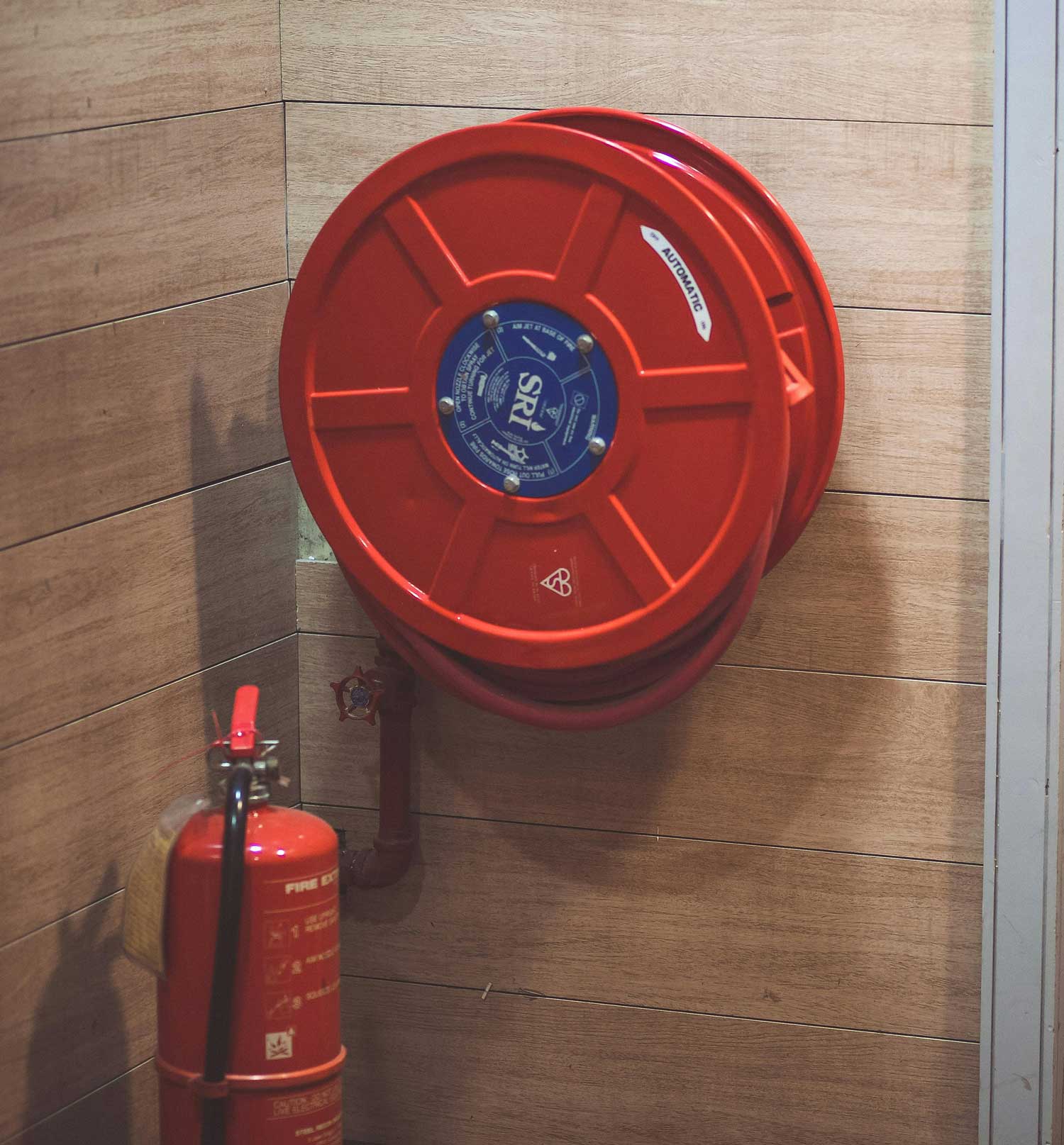 Technician installing fire sprinkler system